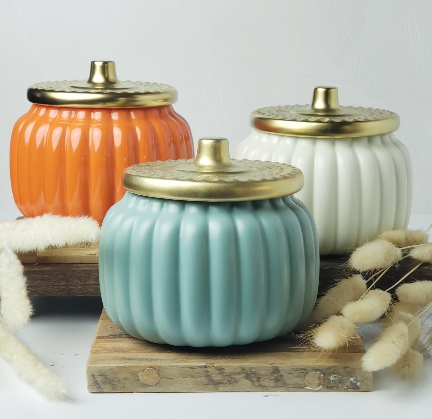 18 ounce teal, cream, and orange pumpkin candles