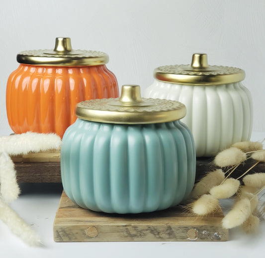18 ounce teal, cream, and orange pumpkin candles