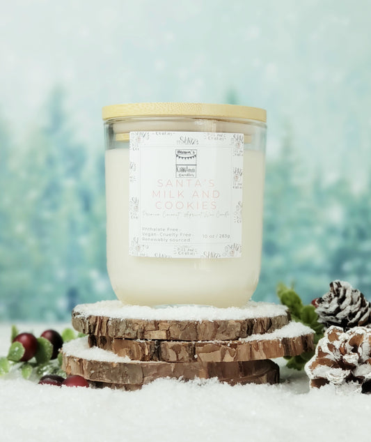 Picture of clear glass candle with wood lid in Santa's Milk and Cookies scent on wood and snow platform.
