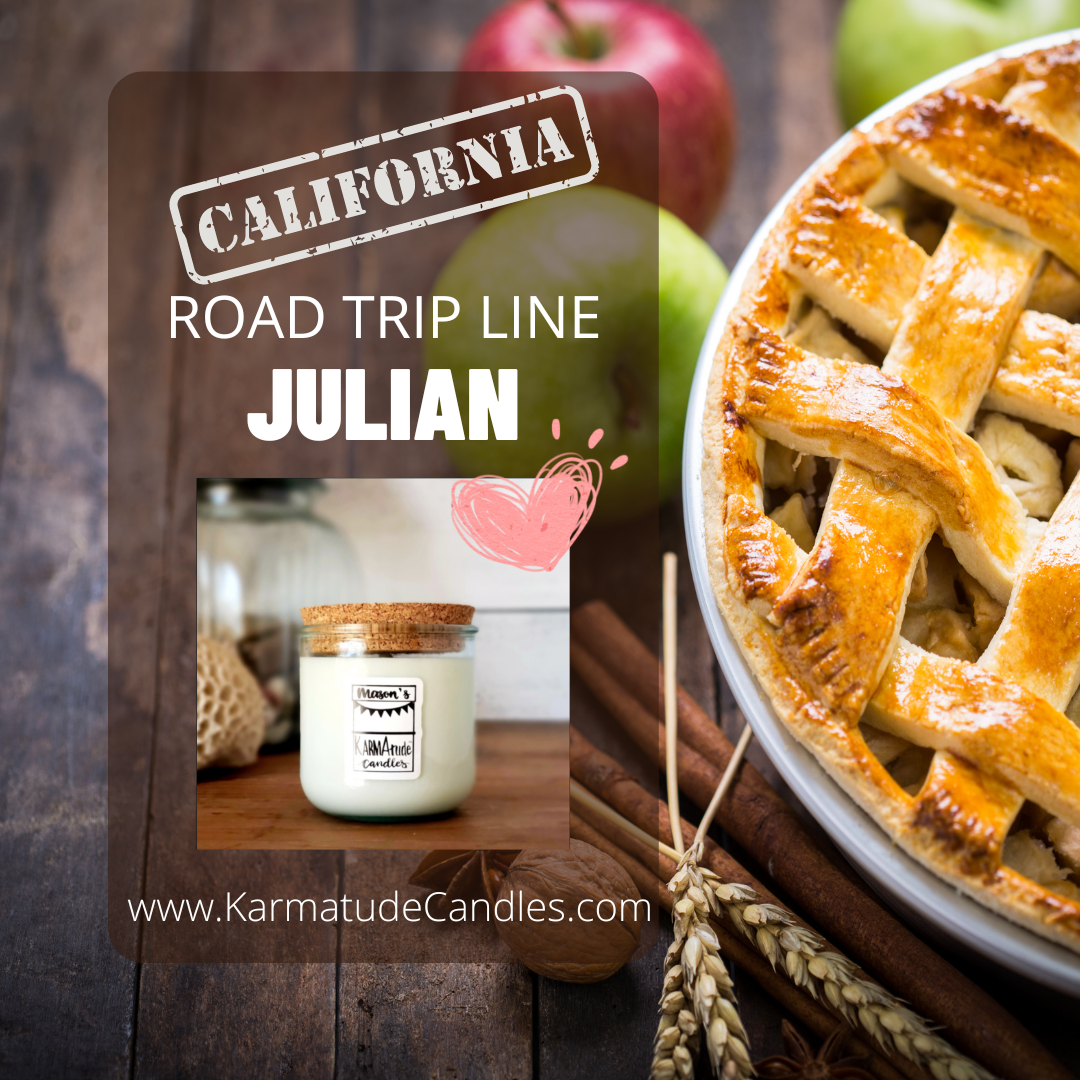 Photo of Julian Karmatude candle in clear glass jar with cork lid surrounded by apples, pie, and cinnamon.